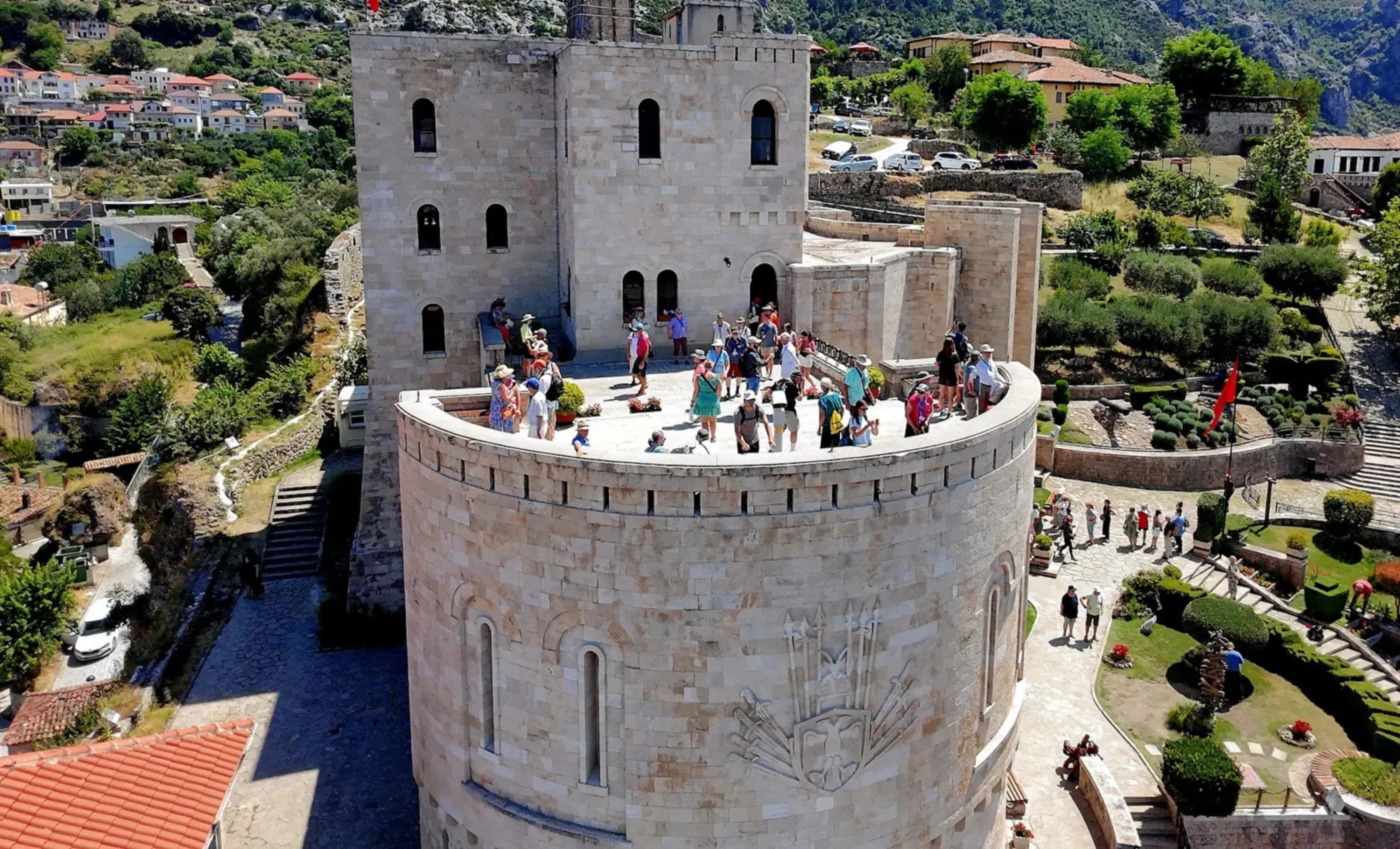 The round tower of Krujë Castle with the mountain behind